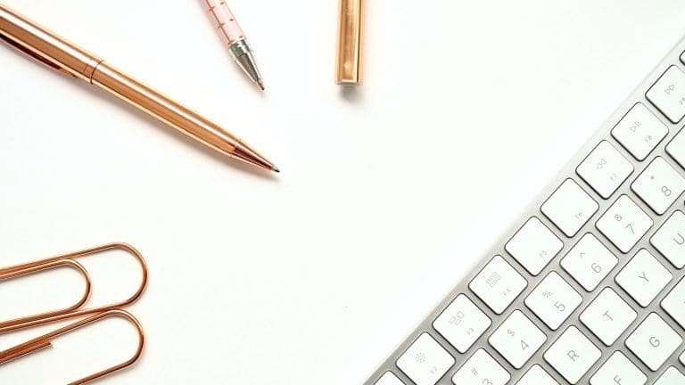 header image computer keyboard with office stationery