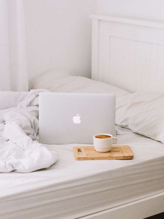 laptop on bed so you can relax