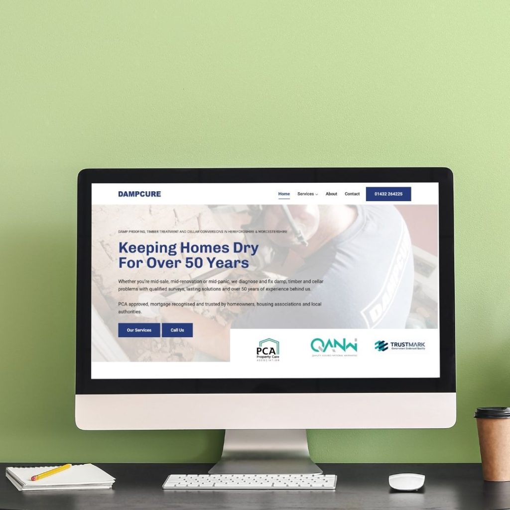 Dampcure homepage shown on computer